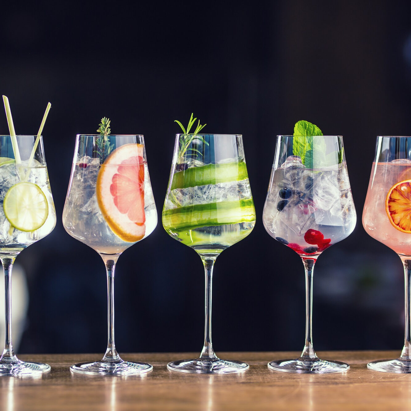 five-colorful-gin-tonic-cocktails-wine-glasses-bar-counter-pup-restaurant